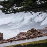 Massive waves slam the NSW coast as a deep low pressure system churns up the Tasman Sea.