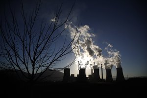 In this Wednesday, Dec. 12, 2018, smoke is emitted from the chimneys of Agios Dimitrios Public Power Plant near Kozani town, northern Greece