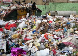 garbage overflowing from a  container, Pune, India