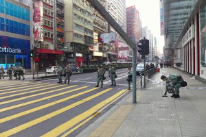 Riot police standby Nathan Road after Fishball Revolution in Hong Kong, 9 February 2016