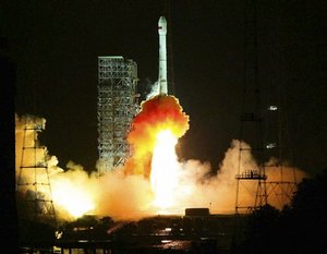 In this photo distributed by the official Xinhua news agency, a Long March 3II rocket carrying a Venezuelan telecommunication satellite, named as Venezuela 1 Telecom Satellite, blasts off from the launch pad at the Xichang Satellite Launch Center, southwest China's Sichuan province, on early Thursday Oct. 30, 2008.