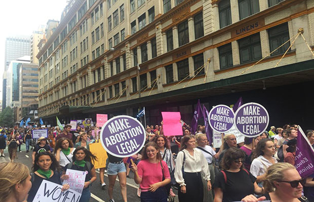 The IWD 2019 march makes its way through Sydney's CBD.