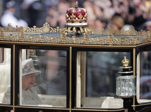 Britain's Queen Elizabeth rides in a carriage to attend the annual Trooping the Colour Ceremony in London, Saturday, June 8, 2019.