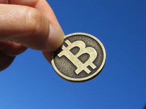 Bitcoin held in hand