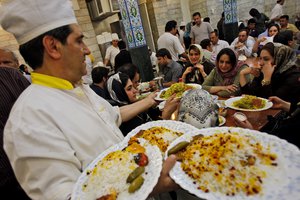 Five days ahead of Iran's presidential elections in June 12, Iranian enjoy a meal in Sharaf Al Islam restaurant at the great Bazaar in downtown Tehran, Sunday, June 7, 2009.