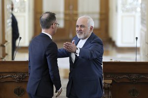 Iranian Foreign Minister Mohammad Javad Zarif, right, gestures to his German counterpart Heiko Maas at the end of their joint press conference in Tehran, Iran, Monday, June 10, 2019.