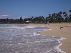 In this photo taken on May 19, 2009, a couple takes a stroll along Hanalei Bay in Hanalei, Hawaii. Hanalei Bay was named the nation's No. 1 beach in "Dr. Beach" Stephen P. Leatherman's annual rankings. Located on Kauai's scenic north shore