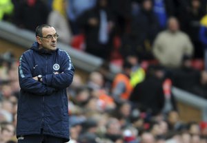 Chelsea manager Maurizio Sarri looks out during the English Premier League soccer match between Liverpool and Chelsea at Anfield stadium in Liverpool, England, Sunday, April 14, 2019.