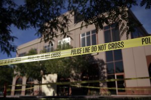 Yellow police tape is strung in front of the Inland Regional Center, site of Wednesday's mass shooting on Monday, Dec. 7, 2015 in San Bernardino, Calif.