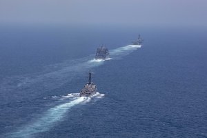 File - The Arleigh Burke-class guided-missile destroyer USS McFaul (DDG 74), bottom, the dry cargo and ammunition ship USNS Alan Shepard (T-AKE 3), center, and the Wasp-class amphibious assault ship USS Kearsarge (LHD 3) transit the Strait of Hormuz, 7 May, 2019.