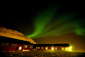 The northern lights dance Feb. 29, 2008 over the Spitsbergen Hotel in Longyearbyen, Norway on the Arctic archipelago of Svalbard, as far north as you can fly on a scheduled flight.