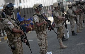 Houthi Shiite fighters stand guard during a rally to mark the third anniversary of the Houthis' takeover of the Yemeni capital, in Sanaa, Yemen, Thursday, Sept. 21, 2017.