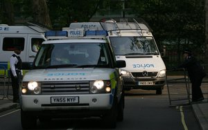 Armed Police escort three vans as they arrive at Westminster Court in London from Sheffield, England, late Friday, April 27, 2007.