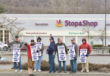 Strikers along the road in front of a Stop and Shop store