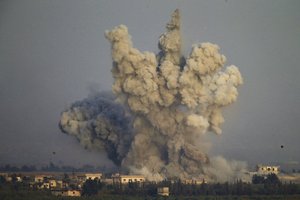 File - Smoke and explosions from the fighting between forces loyal to Syrian President Bashar Assad and rebels in southern Syria are seen from the Israeli-controlled Golan Heights, Wednesday, July 25, 2018.