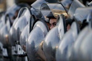 Police block a street that leads to the U.S embassy during a protest against U.S. intervention in Venezuela, in Buenos Aires, Argentina, Tuesday, Feb. 5, 2019.