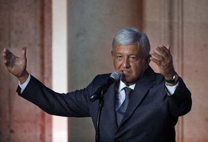 Mexico's President-elect Andres Manuel Lopez Obrador speaks to reporters after meeting with Mexico's President Enrique Pena Nieto at the National Palace in Mexico City, Tuesday, July 3, 2018.