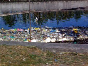 Garbage floats on the riverbanks at Cavite, Philippines as seen in this April 8, 2009 photo.