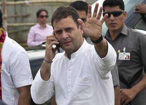 Congress party president Rahul Gandhi waves to supporters as he leaves after an election campaign rally in Bokakhat, Assam, India, Wednesday, April 3, 2019.