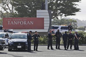 Police investigate at the scene of a shooting at the Tanforan Mall in San Bruno, Calif., Tuesday, July 2, 2019.