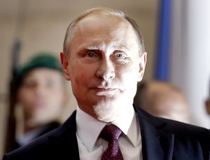 President of Russia Vladimir Putin arrives for a summit with the leaders of Russia, Ukraine and France at the chancellery in Berlin, Wednesday, Oct. 19, 2016.