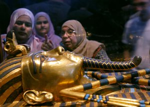 File: In this Feb. 15, 2010 photo, women look at one of the coffins of King Tutankhamun at the Egyptian museum in Cairo, Egypt.