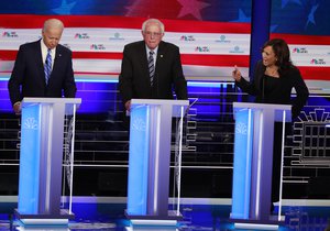 Democratic presidential candidate former Vice-President Joe Biden, left, and Sen. Kamala Harris, D-Calif., spar during the Democratic primary debate hosted by NBC News at the Adrienne Arsht Center for the Performing Arts, Thursday, June 27, 2019, in Miami.