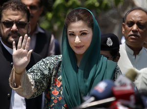 Maryam Nawaz, center, the daughter of Pakistani prime minister Nawaz Sharif waves while she arrives to talk with media following appearing before a Joint Investigation Team, in Islamabad, Pakistan, Wednesday, July 5, 2017. Nawaz appeared before a Supreme Court-appointed team investigating allegations against Prime Minister Nawaz Sharif family's offshore companies and money laundering. (AP Photo/Anjum Naveed)