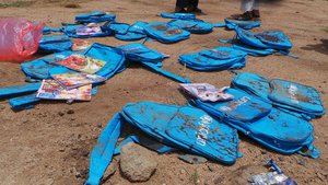 Children's backpacks lie at the site a day after an airstrike in Saada, Yemen on Friday, Aug. 10, 2018.