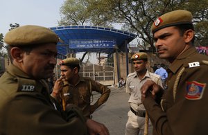 Indian police men stand outside the Tihar Jail, the largest complex of prisons in South Asia, in New Delhi, India, Monday, March 11, 201