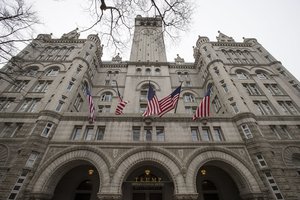 The Old Post Office Pavilion Clock Tower, which remains open during the partial government shutdown, is seen above the Trump International Hotel, Friday, Jan. 4, 2019 in Washington.