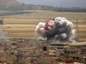 Smoke and fire following reported Syrian government forces' bombardment on the town of Khan Sheikhun, Idlib, June 6, 2019. 