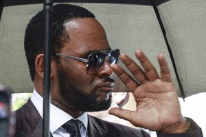 Musician R. Kelly departs from the Leighton Criminal Court building after a status hearing in his criminal sexual abuse trial Wednesday, June 26, 2019 in Chicago.