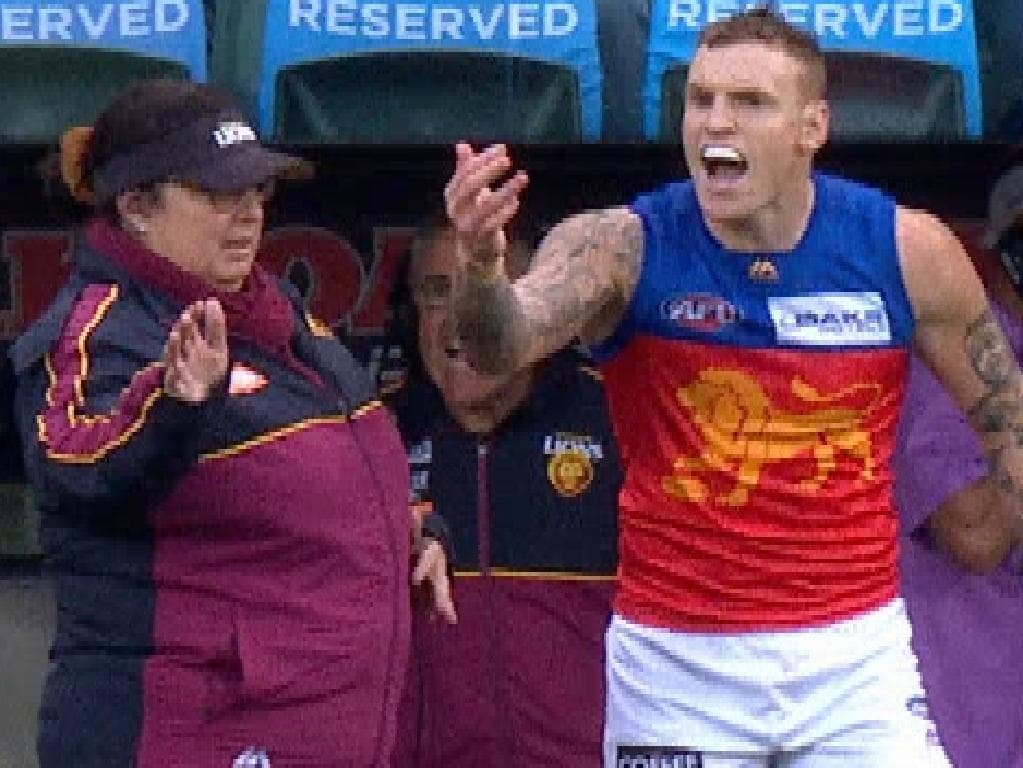 Brisbane's Mitch Robinson stands up for Lachie Neale as Cam Sutcliffe comes off the ground in Adelaide.