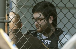 James Alex Fields Jr., is led out of General District Court courthouse after his sentencing on state charges in Charlottesville, Va., Monday, July 15, 2019. Fields was sentenced to life plus 419 years on federal hate crime charges Monday for deliberately driving his car into anti-racism protesters during a white nationalist rally in Virginia. (AP Photo/Steve Helber)