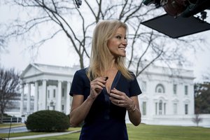 President Donald Trump's adviser Kellyanne Conway gets ready to go on television outside the White House, Sunday, Jan. 22, 2017, in Washington.