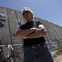 Pink Floyd co-founder Roger Waters touring Israel's security barrier in the West Bank refugee camp of Aida near Bethlehem, June 2, 2009. (Muhammed Muheisen/AP Images)