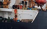 In this photo from July 6, 2019, crew members walk down a ladder on board supertanker Grace 1, off the coast of Gibraltar on July 6, 2019. (Jorge Guerrero/AFP)