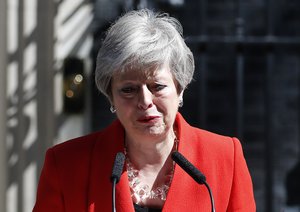 British Prime Minister Theresa May reacts as she makes a speech in the street outside 10 Downing Street in London, England, Friday, May 24, 2019.