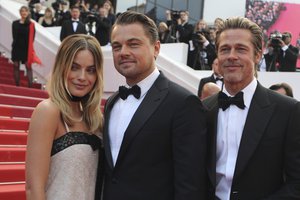 Actors Margot Robbie from left, Leonardo DiCaprio and Brad Pitt poses for photographers upon arrival at the premiere of the film 'Once Upon a Time in Hollywood' at the 72nd international film festival, Cannes, southern France, Tuesday, May 21, 2019.