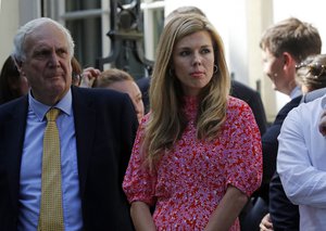 Carrie Symonds the girlfriend of Britain's new Prime Minister Boris Johnson waits in 10 Downing Street, London, Wednesday, July 24, 2019.