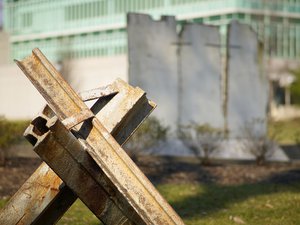 Monument to the Berlin Wall with part of the concrete wall in the background. Identifying deaths specifically attributable to the Berlin Wall is not straightforward