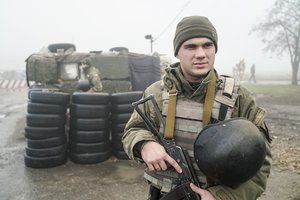 Ukrainian national guard soldiers stand in position at the checkpoint in Berdyansk, south coast of Azov sea, eastern Ukraine, Tuesday, Nov. 27, 2018.