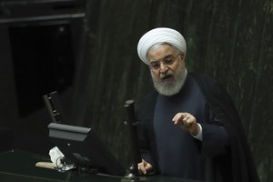 Iranian President Hassan Rouhani speaks at a session of parliament to debate his proposed tourism and education ministers, in Tehran, Iran, Tuesday, Sept. 3, 2019.