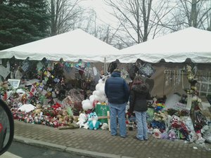 File - The Sandy Hook Elementary School makeshift memorial on Washington Avenue in Sandy Hook, Connecticut, 12 days after the shootings at Sandy Hook Elementary School, 26 December, 2012.  Adam Lanza shot and killed 26 people, including 20 children between six and seven years old, and six adult staff members.