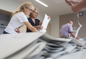 Election workers count votes after completion of the voting procedure in a polling station, the secondary school Buehlau, in Dresden, eastern Germany, Sunday, Sept. 1, 2019