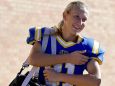 Stephanie Sparkowski, left, walks toward the football field