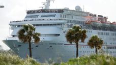 A Carnival Fantasy cruise ship leaves PortMiami, in