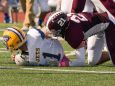 Jack Cascadden of Garden City tackles East Meadow's