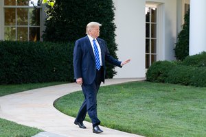 President Donald Trump walks from the Oval Office to talk to members of the press on the South Lawn of the White House Friday, Aug. 30, 2019, prior to boarding Marine One to begin his trip to Camp David near Thurmont, Md.